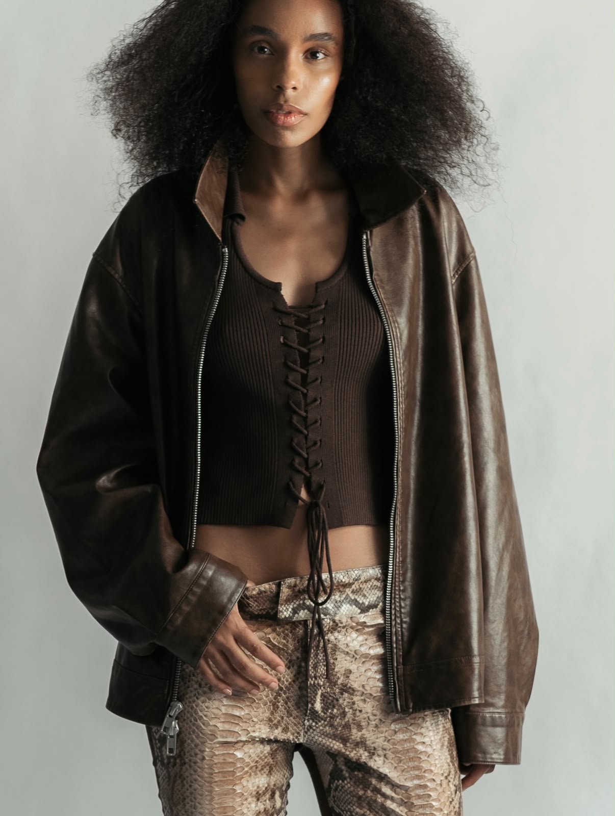 Agatha Neves in leather jacket and snakeskin trousers
